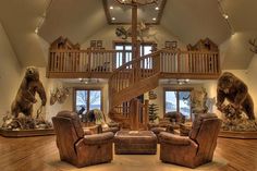 a living room filled with furniture and a spiral staircase