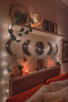 a bedroom with lights and mirrors on the wall