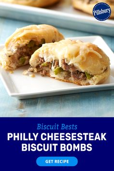 a white plate topped with meaty cheesesteak biscuits next to a blue tray