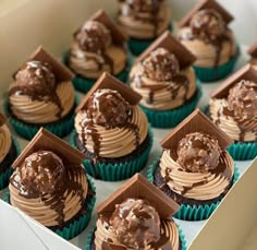 cupcakes with chocolate frosting in a box