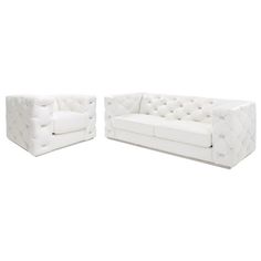 a white couch and chair sitting next to each other on top of a white floor