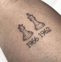 a tattoo with chess pieces on it and the words 1960 - 2010 written in black ink