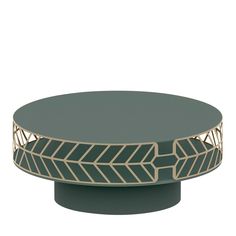 a black and gold coffee table with an arrow design on the top, in front of a white background