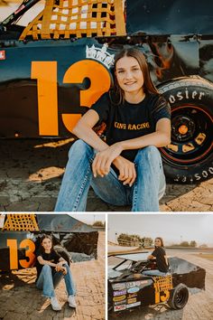 a woman sitting on the ground next to a race car and posing for a photo