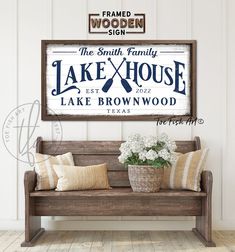 a wooden bench sitting in front of a wall with a sign above it that says the smith family lake and brownwood