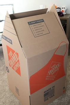 an open box sitting on the floor in a room