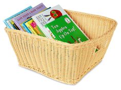 a wicker basket with books in it