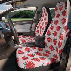 the seat covers in the car are decorated with strawberries