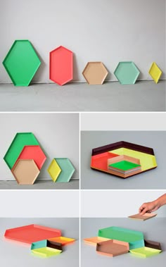 four different colored geometric shapes on the wall