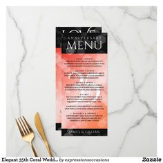 a black and white menu card with gold forks