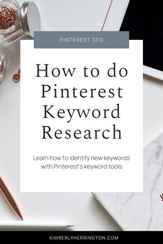 a white desk with the words how to do pinterest keyword research on it