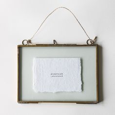 a piece of paper hanging from a frame