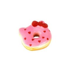 a pink donut with hearts on it