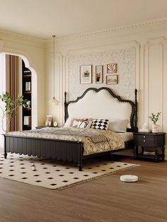 a bedroom with white walls and wood floors