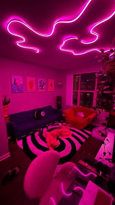 a living room filled with furniture and neon lights on the ceiling above it's windows