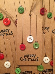 christmas tags with buttons attached to them