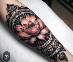 a woman's arm with a flower tattoo on it