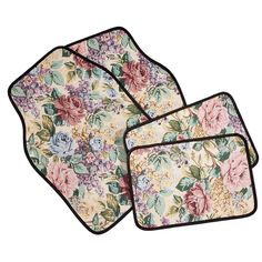 three place mats with flowers on them