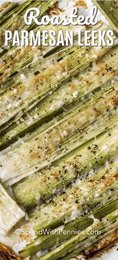 roasted parmesan leeks on a white plate with text overlay that reads roasted parmesan leeks