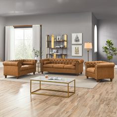 a living room with two couches and a coffee table in front of a window