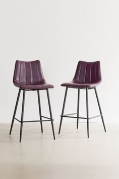 two purple chairs sitting next to each other