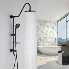 an open shower head with thermostaer and handset in front of a large window