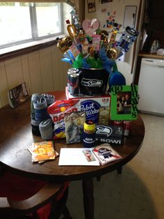 a wooden table topped with lots of different types of food and drinks on top of it