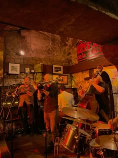 a group of people playing instruments in a room