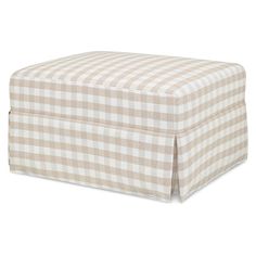 a tan and white checkered ottoman