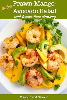 prawn mango avocado salad with lemon - lime dressing in a white bowl