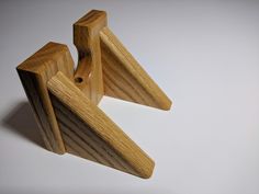 three pieces of wood sitting on top of each other