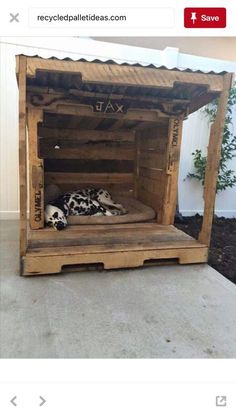 a dog bed made out of pallet wood