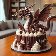 a cake decorated with chocolate frosting and a dragon figure on top is sitting on a table in front of a couch