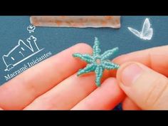 someone is stitching a small star ornament