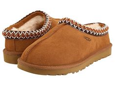 UGG Tasman (Chestnut) Women's Shoes The Tasman always fits tight at first especially if someone has a high instep or high volume foot. It does stretch out over time. If you are in between sizes please size up or down based on the volume of your foot and height of your instep. Take the Tasman from weekday lounging to a Saturday excursion! Suede upper with an embroidered Tasman trim. Raw seam down the center. Embossed UGG logo at lateral s #UGG #Shoes #ClosedFootwear #GeneralClosedFootwear #Brown Ugg Boots Outfit, Ugg Tasman Slippers, Ugg Tasman, Sheepskin Slippers, Ugg Slippers, Sneaker Slippers, Shoes With Jeans, Slipper Shoes, Tasmania