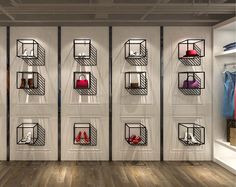 an empty room with several shelves filled with purses and shoes