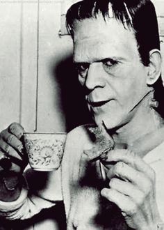 black and white photograph of a man eating cereal