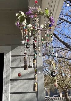 a wind chime hanging from the side of a house