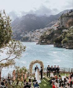 an outdoor wedding ceremony overlooking the ocean