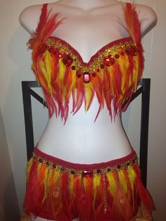 an orange and yellow belly dance costume on display