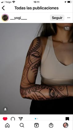 a woman's arm with tattoos on it