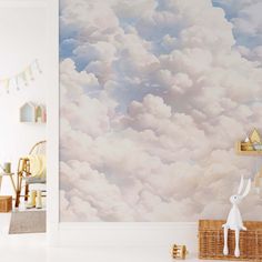 a child's room with clouds painted on the wall and stuffed animals in baskets