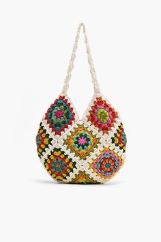 Shoulder bag Crochet Top Handle Colorful floral patchwork from front to back Magnetic button closure Lined interiors with zip pocket Size: 13.5" x 12.5" Embrace your free-spirited style and make a statement with this bohemian-inspired bag that's as practical as it is stylish. The Slouchy Crochet Shoulder Bag is a bohemian-inspired accessory that effortlessly combines style and functionality. Crafted with care and attention to detail, this shoulder bag is perfect for those who appreciate unique a Bohemian Hobo Bag With Braided Handles For Spring, Multicolor Hobo Bag With Braided Handles For Beach, Spring Bohemian Rectangular Hobo Bag, Multicolor Woven Hobo Tote Bag, Multicolor Woven Hobo Bag, Spring Bohemian Tote Shoulder Bag, Bohemian Spring Tote Shoulder Bag, Spring Bohemian Woven Hobo Bag, Bohemian Spring Tote Bag