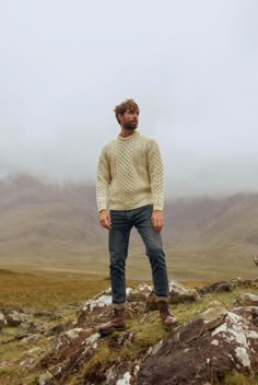 The Islands of Ireland are steeped in Irish mythology, legend and tradition that have inspired our Aran knitwear Collection. Tap into the magic of Irish tradition with our Inishbofin Traditional Aran Sweater. Made with beautiful, high quality Worsted wool, this Aran sweater is the perfect companion to keep you warm and comfortable no matter how you spend your day. You’ll notice that this Aran sweater boasts the traditional Aran honeycomb stitch. Inspired by the fishermen of the past, this stitch Mens Outdoor Style, Outdoorsmen Style, Commando Sweater, Alpine Chic, Sweater Outfits Men, Irish Fashion, Irish Sweater, Irish Mythology, Honeycomb Stitch