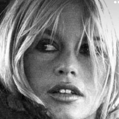 a black and white photo of a woman with blonde hair