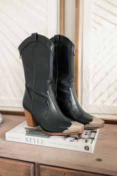 Saddle up in style with the Wallen Western Bootie! These trendy boots feature a classic western design with a playful twist. Fits true to size Metallic Silver Toe Tip Western Cowboy Booties Faux Leather Shaft Height: 9.5" Heel Height: 3" Western Glam Outfit, Western Formal, Black Cowgirl Boots, Western Glam, Cowboy Chic, Black Cowboy Boots, Glam Outfit, Trendy Boots, Western Chic