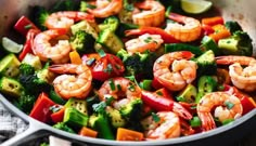 shrimp, broccoli and peppers in a skillet