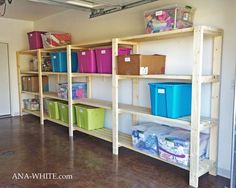 there are several shelves in the room with bins