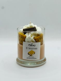 a small glass jar filled with some kind of dessert