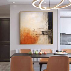 an abstract painting hangs above a dining room table